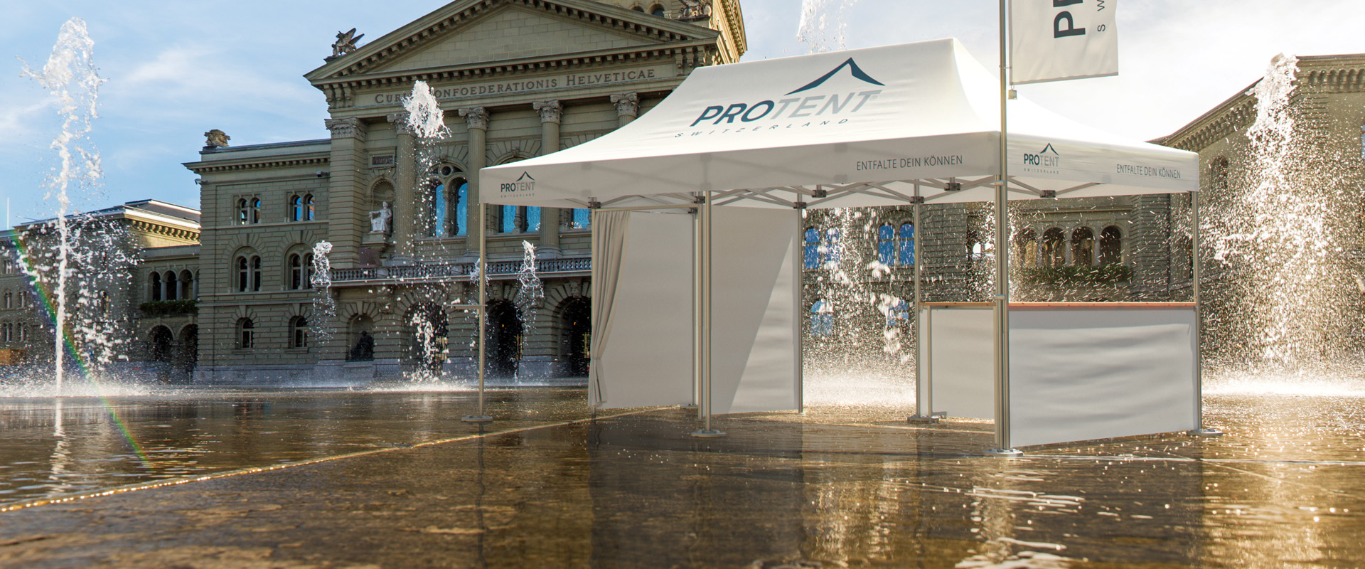 A Pro-Tent folding tent stands in front of the Federal Palace in Bern.