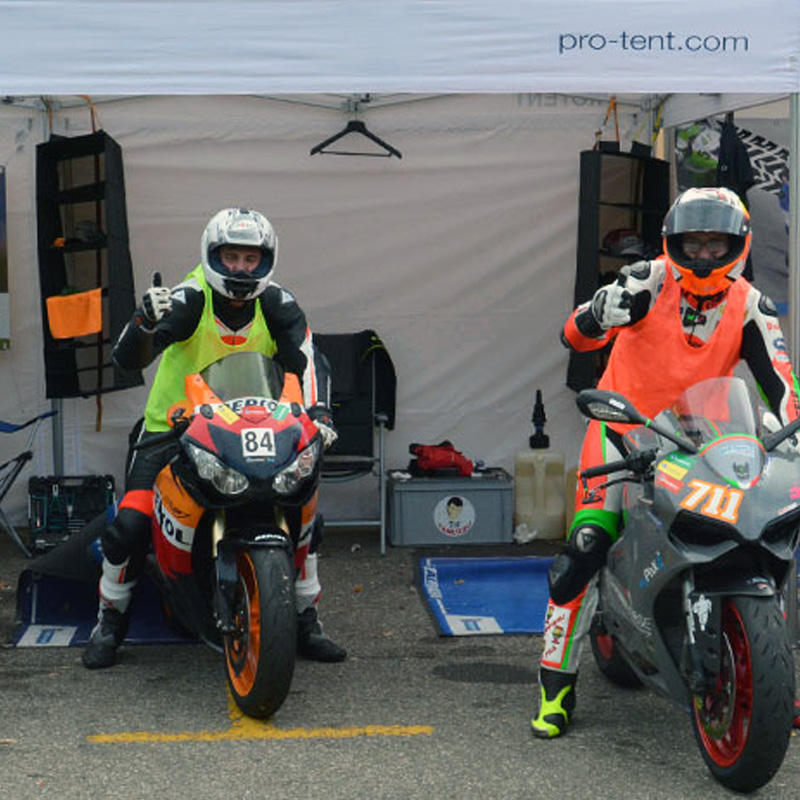 A Pro-Tent folding tent being used as a racing tent at a motorsport event