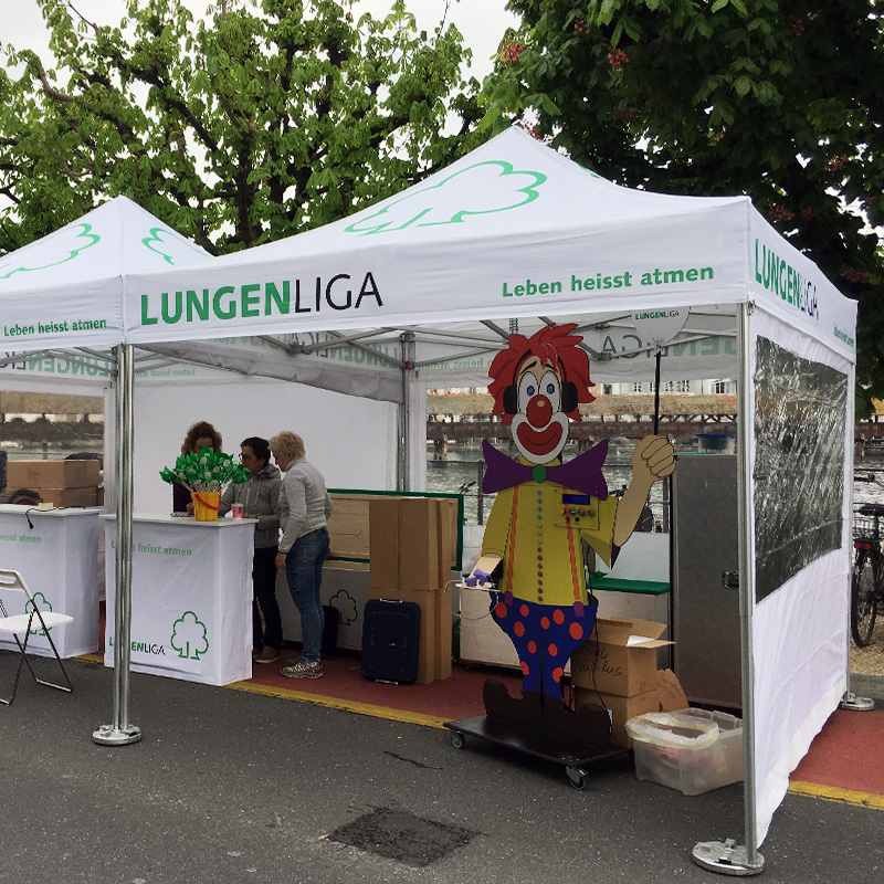 A Lung League association tent being used as an information stand at a city festival.