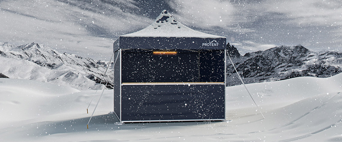 A well-tensioned Pro-Tent folding tent defies a snowstorm with stability and wind resistance.