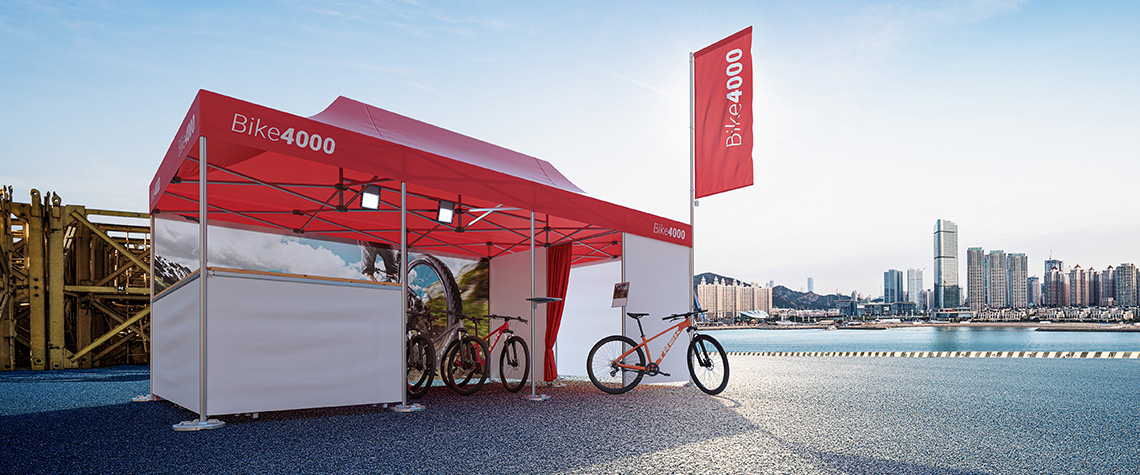 Bike3000 use a Pro-Tent folding tent as an effective advertising stand to show their products.