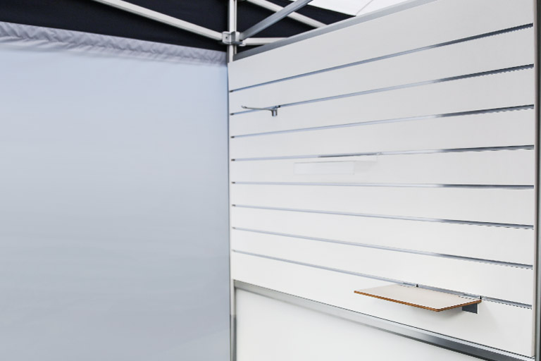The Spacewall© slat wall with hooks and shelves.