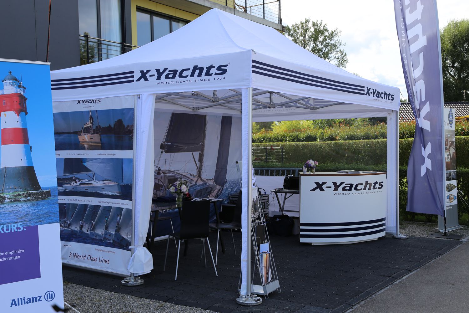 Pro-Tent floor panels in use under a folding pavilion from X-Yachts.