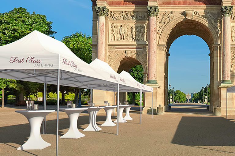 Several Pro-Tent festival tents are erected in front of a landmark.