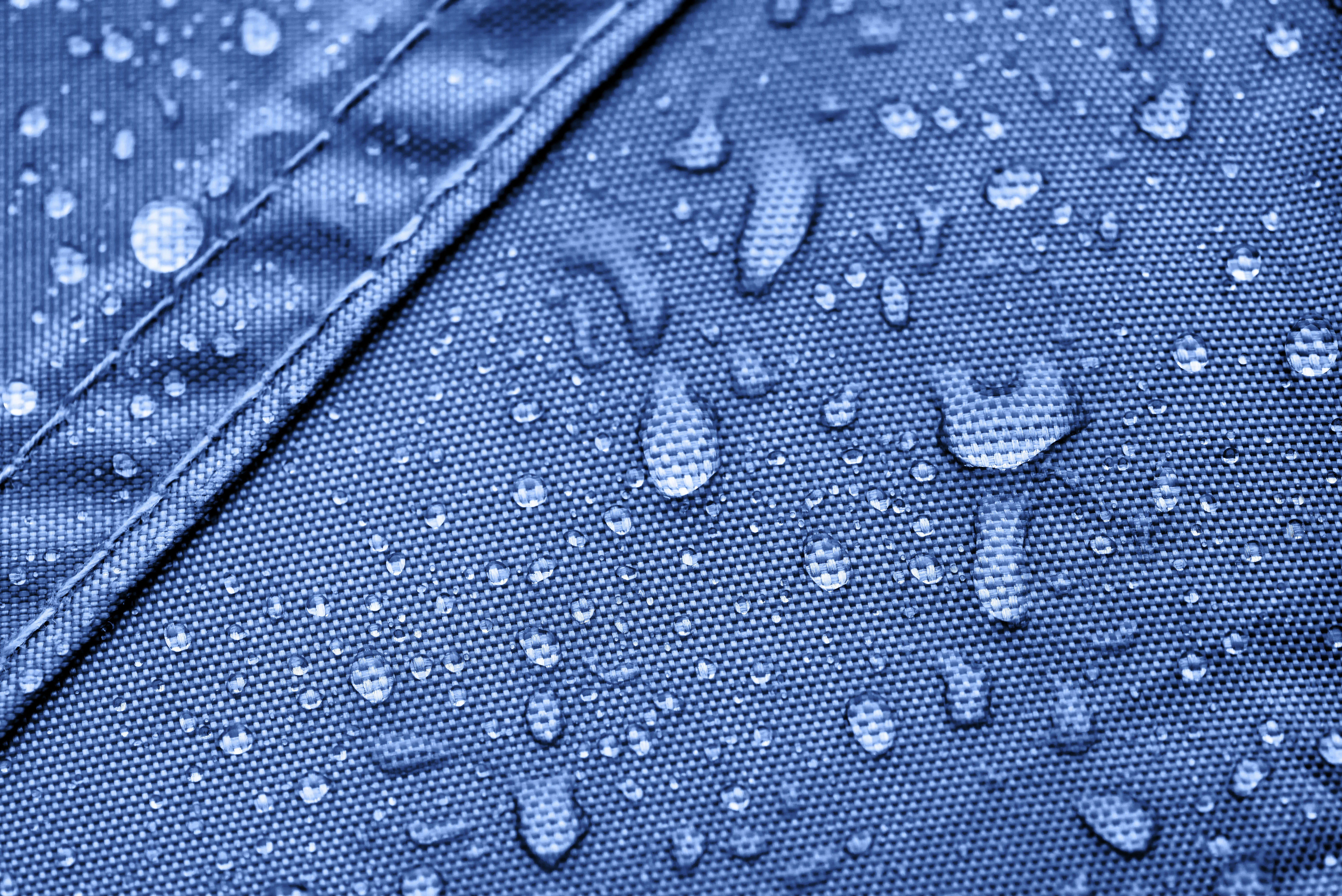 Water rolls off the side wall of a Pro-Tent medical tent.