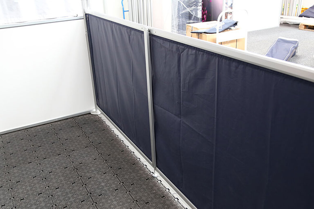 Telescopic connector with support attached to a half-height side wall of a tent.