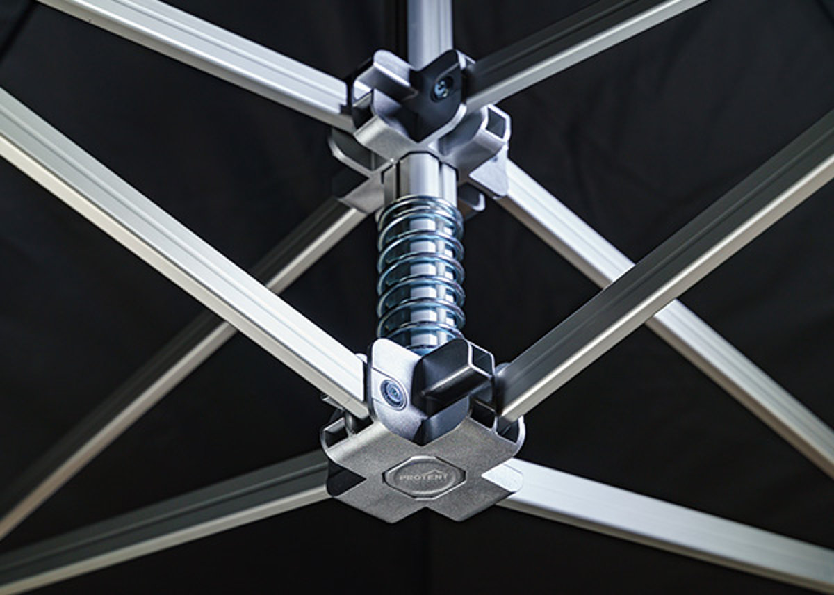 Close-up of the robust gable spring in the roof frame of a folding tent.