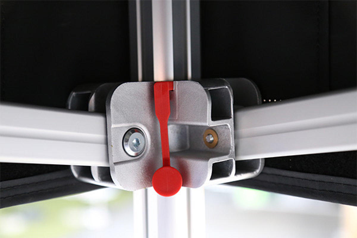 A close-up of a design connector made of high-tech plastic in the folding tent frame by Pro-Tent.