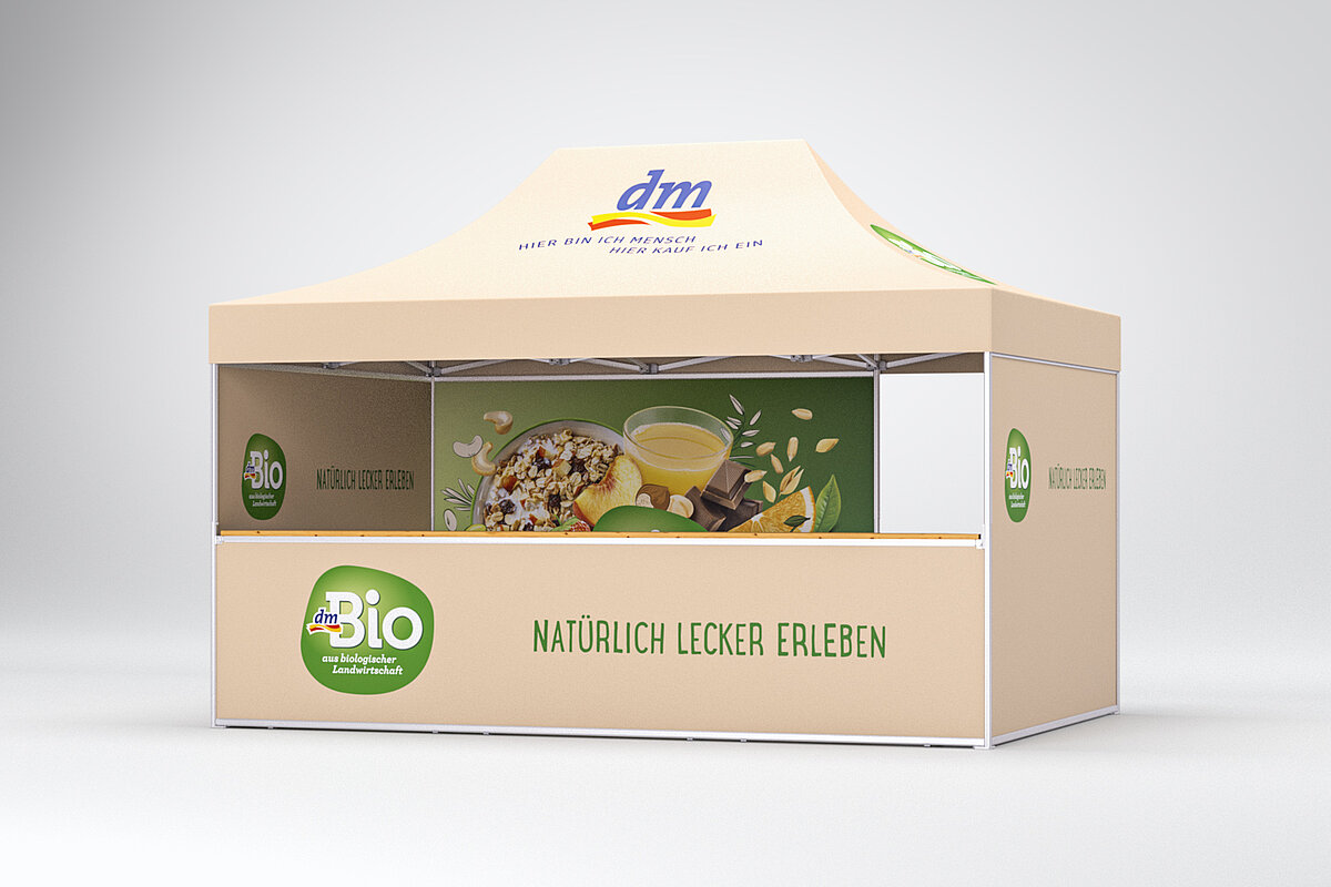Ein Pro-Tent Faltzelt mit Bedruckung im DM-Bio-Look.