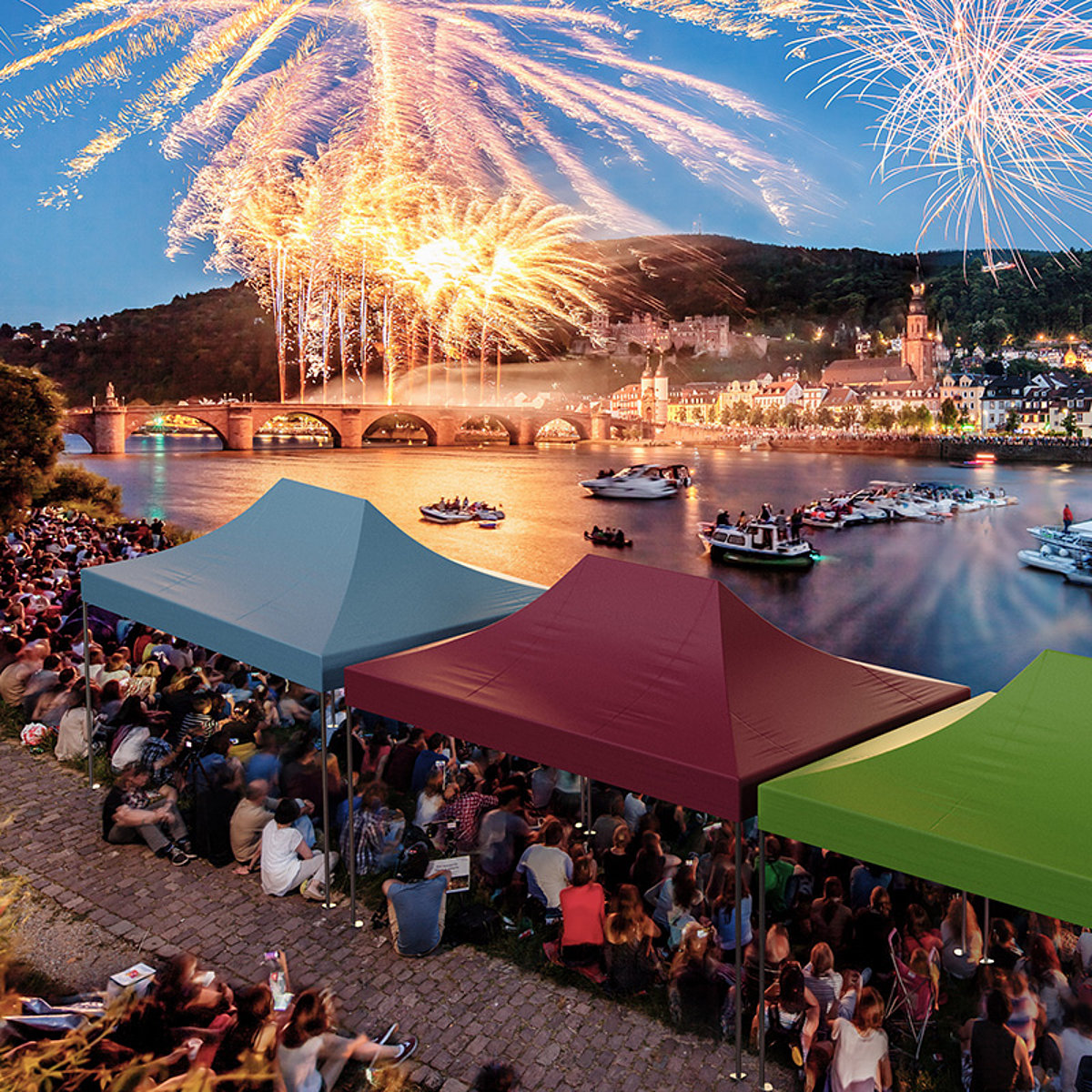 Three event tents from Pro-Tent being used at a town festival with fireworks at the harbour.