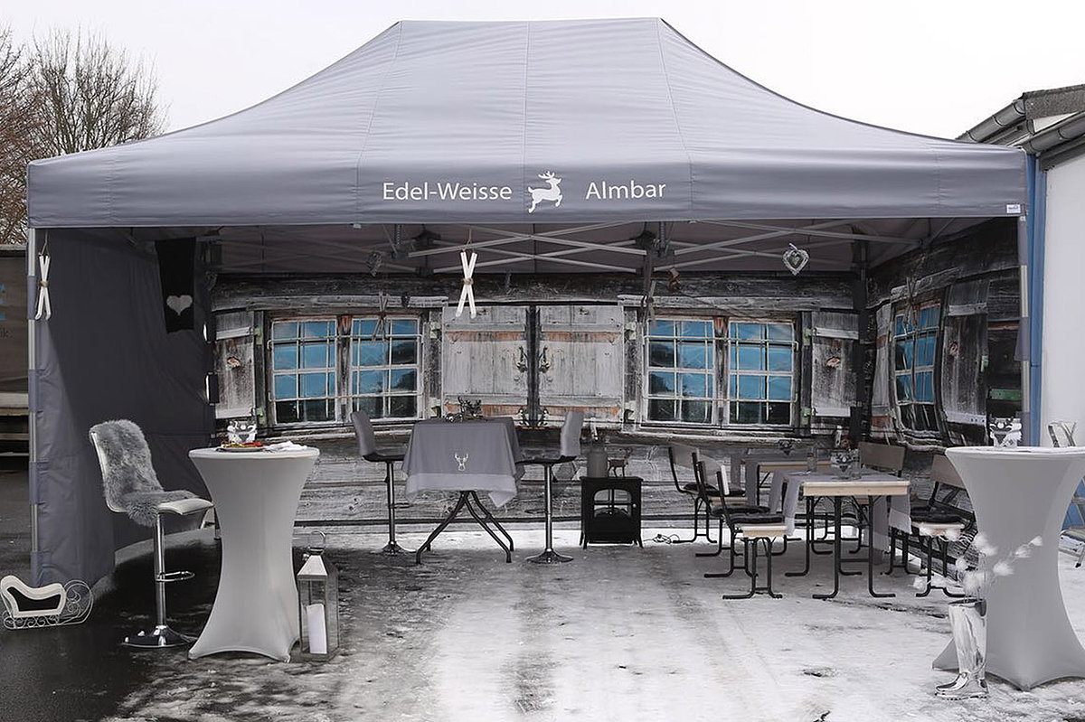 A catering tent is used for an outside bar.