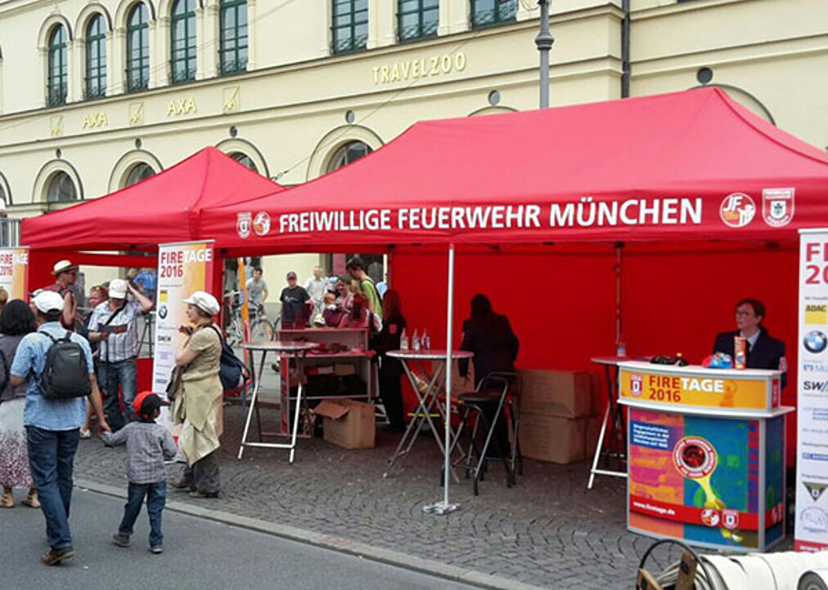The Munich Volunteer Fire Brigade uses a fire tent from Pro-Tent to recruit members at a city festival.