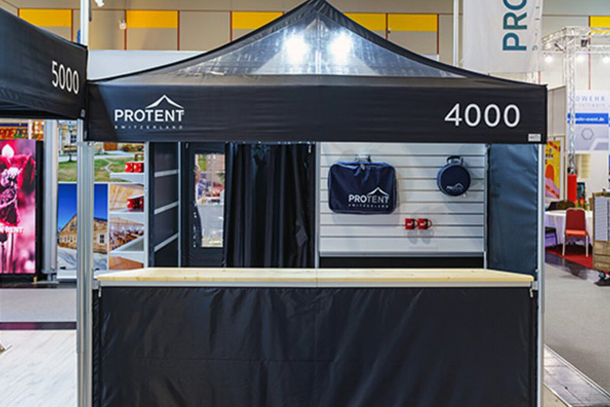 A folding pavilion with various accessories, e.g. bar counter.