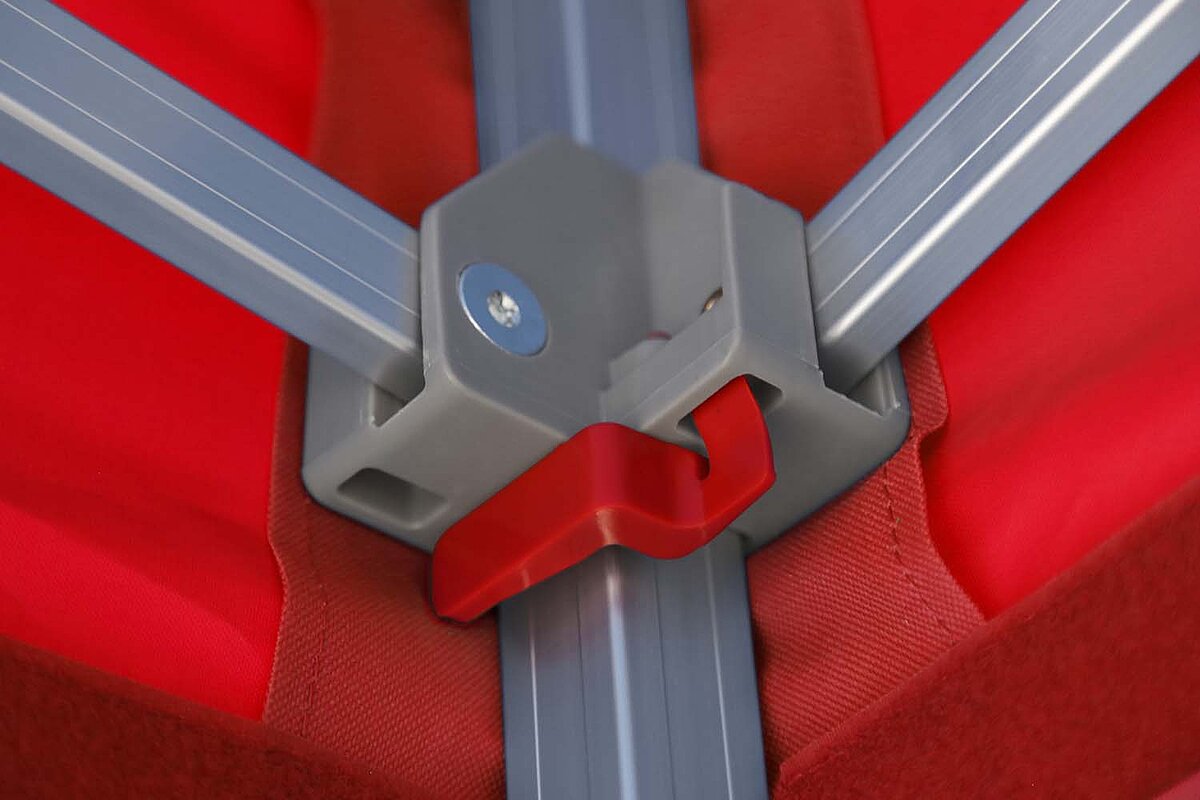 Close up of the press-stud remover for unlocking.