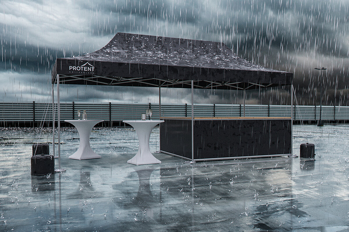 Ein Pro-Tent Faltpavillon steht im strömenden Regen, wobei kein Wasser durch den wasserdichten Stoff dringt. 