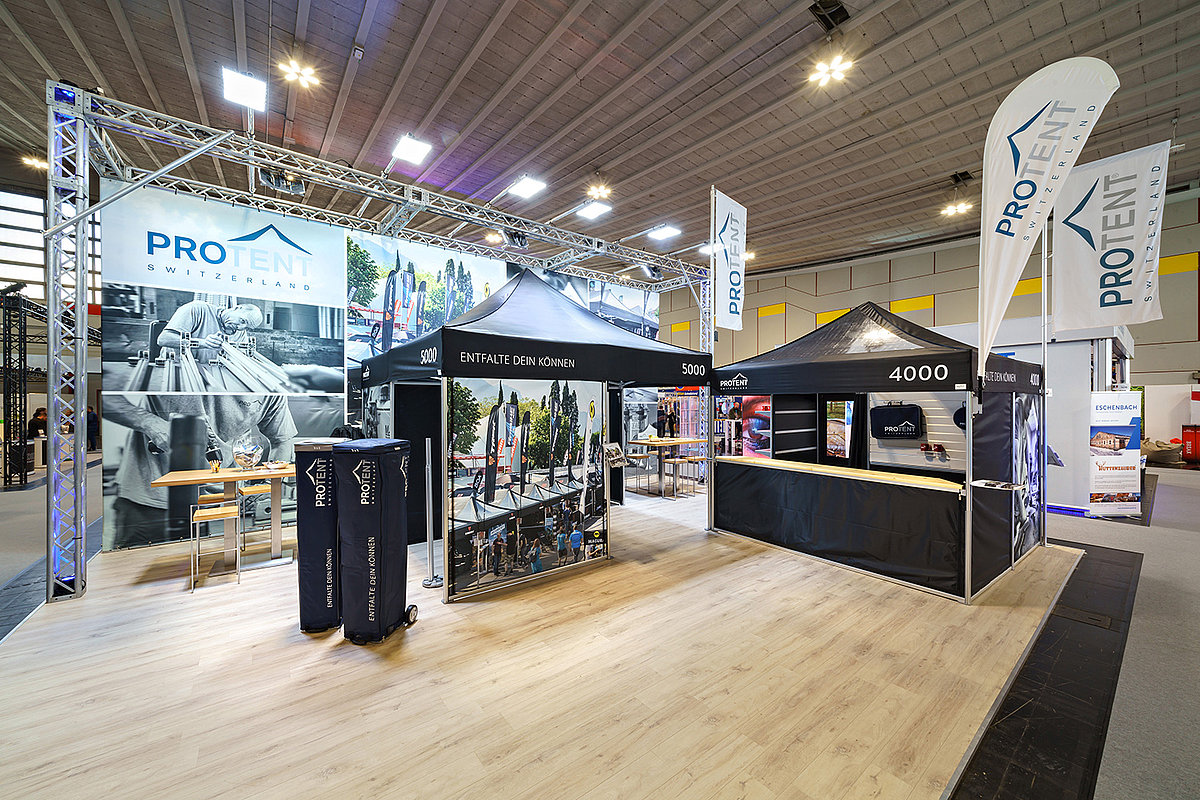 Two Pro-Tent folding tents are used indoors as exhibition stands.